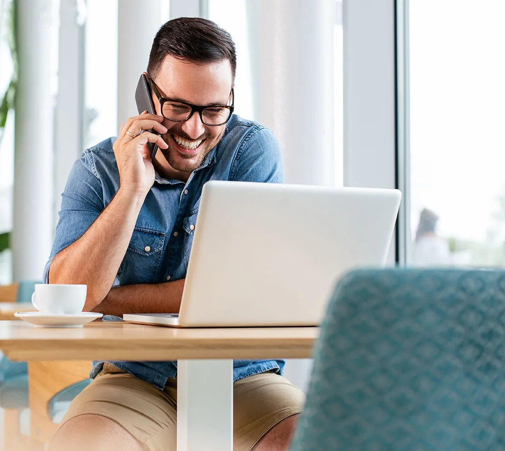 Relaxed business owner on the phone with his accountant